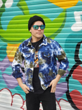 originally white denim jacket (man's cut) hand dyed in navy-olive-denim colors. Modeled by my son Rob; he has the sleeves rolled up and the front open. He's wearing a tee shirt under, a pair of black jeans and a black cap to make the outfit. Oh, and really cool shades