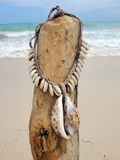 crocheted hemp choker necklace with a large Tiger Cowrie Shell pendant and 12-12 smaller sliced shells on the sides