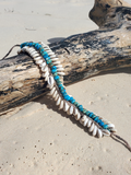 the base of this choker is a crocheted hemp strip, ties and adjusts