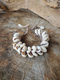 crocheted hemp and 2 rows of sliced cowrie shells bracelet with ties