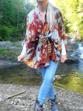 This is a one size - fit s-4x style, a cacoon like poncho, or sweater. The rayon jersey fabric is brushed on the outside, which creates a very fuzzy texture! Very soft and cozy! The style has 2 sleeve openings, depending on your size, your arms will show from elbow to mid upper arm. The sweater poncho has no closure, can be secured with a large decorative safty pin, or as I'm modeling it, with a belt.