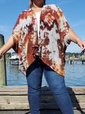 The same one size cacoon like sweater poncho is modeled by Ana, who is a size 2/3XL. The garment here is just" hanging" on her.