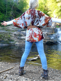 In this photo; it's me again; I am a size small, showing the sweater's back. I'm wearing ajeans and boots with this outfit, and a belt to hold the open front together.