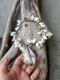 showing the opening (front) of the shell pendant. The necklace is worn with the back up. I can also add a sliced shell if you p[refer the open side of the shell