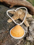 captured orange shell with crochet necklace