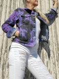 Cropped Stretch deni jacket modeleb by me. I hand dyed it in black first, then covered the still white areas with a lavander colored dye. The jacket has all the usual jacket features; collar,metal buttons, chest pockets with buttoned flaps, side pockets. I am wearing a pair of white jeans and a tank with this jacket. Here I'm wearing the jacket unbuttoned and cuffs rolled