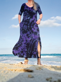 A frontal, and similra shot at the beach, with the blue Caribbean waves in the back, one leg showing through the side slit