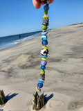 various in size and shape beads with knotted deviders