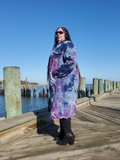 Side view of my curvy 2/3xl model wearing the same long coat in a size 3XL . Since the jacket is cut straight and not shaped to accommodate feminine and wider hips (most women have those!), she can't button the coat all the way. Please double check all the measurements!. These photos were taken at a bay area in NJ.