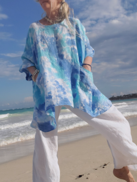 A one size s-4x loose and comfy linen shirt or tunic with small front pockets, hand dyed in pretty sky colors