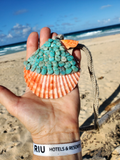 large peach-orange shell beaded with amazonite beads, on a crocheted linen ope