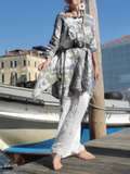 worn with a belt and linen pants under