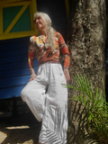 A short drape front cardigan hand dyed in bright earthy colors. It can be wrapped around and tied in the back in the smaller sizes.