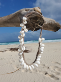 I just didn't want to skip this photo. I love the beach; beige sand, blue sky and water with white waves behind the necklace
