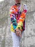 Wearing the jacket with white jeans, I have my arms front of me; showing you the length of the sleeves. man's small jacket on my lady's small frame