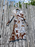 I took this photo  of the long cardiagn, displayed on a hanger, hooked up on our fence.