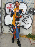 Kind of the same, but a front view; one hand is on her shoulder, the other one is holding the long scarf.
