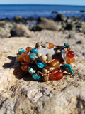 an up-close shot, button-loop closure, layered as a 5-times wrapped bracelet