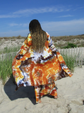 Beach photoshoot (Jones Beach, NY). My friend My is modeling this  very pretty tie dye cardigan: it is a basic midi cardigan with open front, pockets, and a very leigh weight rayon jersey fabric. Here I took a photo of Mu's back. She has her hands in the pockets, also holding out the fronts. The wind is also blowing. Hand dyed colors: brown-khaki-rust-oj.. Mu also has a matching tie dye maxi skirt on, and a sexy white wrap top.