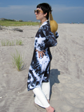side view of Steph; she has her arms on her hips. The cardigan is hand dyed with black color, the black and white pattern looks very stylish!