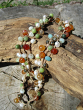a close-up of the carnelian-amazonite-pearl-jade-hematite beads