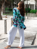 this style has a half sleeve, a feminine scoop neckline, side slits, longer back