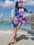 front view of long sleeve cardigan, fronts are shaped asymmetrical, self belt can be wrapped around.