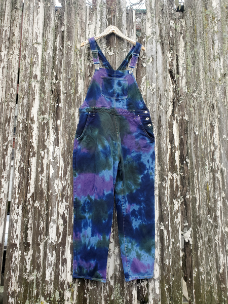 Upcycled overalls in fun tie dye colors; side buttons on the left side, bib pocket, back pockets