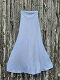 White (not yet dyed ) skirt on a wooden surface