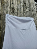 Showing an not yet dyed skirt with the waist detail on wooden surface