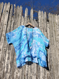 Same shirt pinned toour fence, showing the actual shape of this style. And the hand dyed colors.