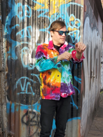 I took this shot of Robe unrolling the sleeves. He's wearing a tee shirt, black jeans and black sneakers with this outfit. The denim jacket was hand dyed by me in vibrant rainbow colors; yellow-oj--pink-purple-green-jade and a bit of black.