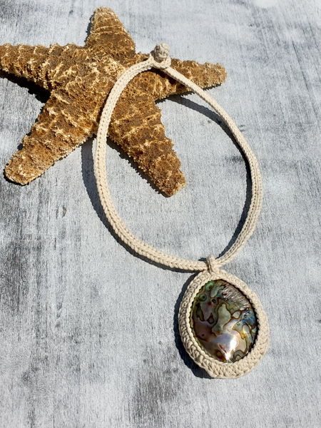 Starfish with a necklace featuring a round abalone pendant - caged, crocheted, on an 18" crocheted rope