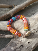 red blue red yellow and orange beads - oh, and one in mint - pretty patterned glass beads