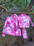 The same 2 jackets hung on a tree (a 2T & a XL), showing the back.