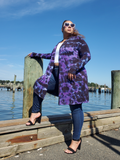 A very preatty, easy to wear long sleeve cardigan with pockets. Cut straight, has an open front with V-neck shape. Lightweight flowy rayon jewrsey. My model is a 2/3XL beauty, modeling a size 3XL. She is 5'7", the midi cardigan ends around her knees.