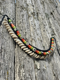 Necklace with beads on a wooden surface