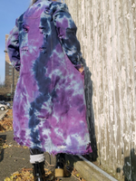 Tie Dye Long coat; I am the model for this amazing style; I hand dyed the light denim blue garment in navy and purple shades. The jacket  is cut straight, the hems look unfinished and distressed. There are also distressed areas all over the garment. . Back view of the jacket/coat.