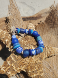 Blue beaded bracelet on a starfish with a natural background