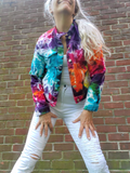 A fun and goofy pose by me; the jacket is unbuttoned, the sleeves are down; This is a juniors style; I am wearing a medium jacket. My measurements are 34'-28"-38", a size small, and this juniors Medium jacket fits like a women's small .