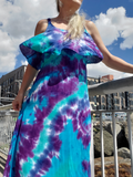 A close-up; I'm modeling a small dress; a very lightweight woven rayon maxi dress, slit on one side, deep round neck, flounce top, elastic under the chest. A strapy top. Purples-jade-turquoise tie dye colors