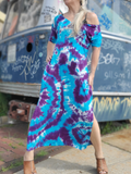 A frontal shot of my best seller kind of short sleeve dress; I took the selfies front of a bus rack with graffiti. Tie dyed in purple and turquoise colors. See next