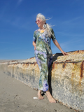 photo taken at the beach, dress is modeled with shell necklaces