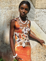 The longer - 40" necklace modeled with some other jewelry & a tie-dye dress
