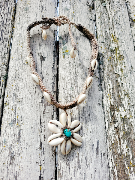 crocheted hemp choker with a cowrie shell flower pendant