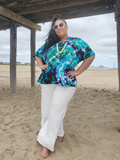 a sweet style shot - at the beach, under the pier, Ana has her hands on her hips