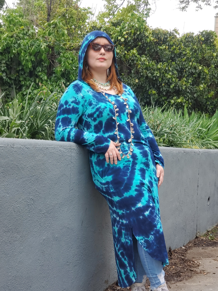 This is Zoey, a size xl beauty; she's modeling my long sleeve hooded dress (side slits, pockets, V-neck), hand dyed in Navy & jade colors. There is no white showing (maybe just a hint of white here and there). Zoey is leaning against a grey wall, elbow up, looking cool with her shades on!