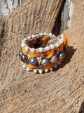 Multicolored beaded bracelet on a wooden surface