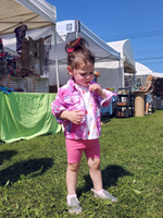 I took this photo at New Paltz, one of my favorite crafts shows; a little girls is wearing her new Barbie tie dye jacket!