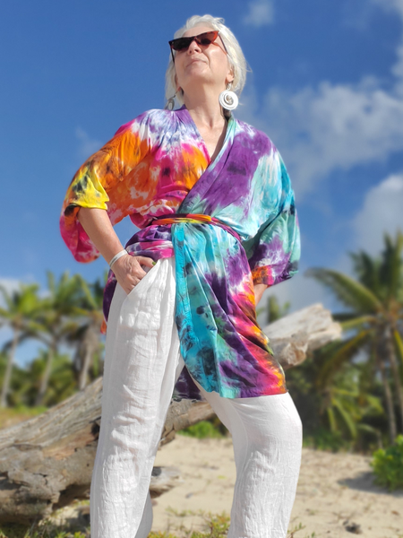 RAINBOW Galaxy Tie Dye Kaftan worn with a pair of white pants